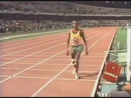 John Stephen Akhwari finishing the 1968 Olympic marathon with a dislocated knee.